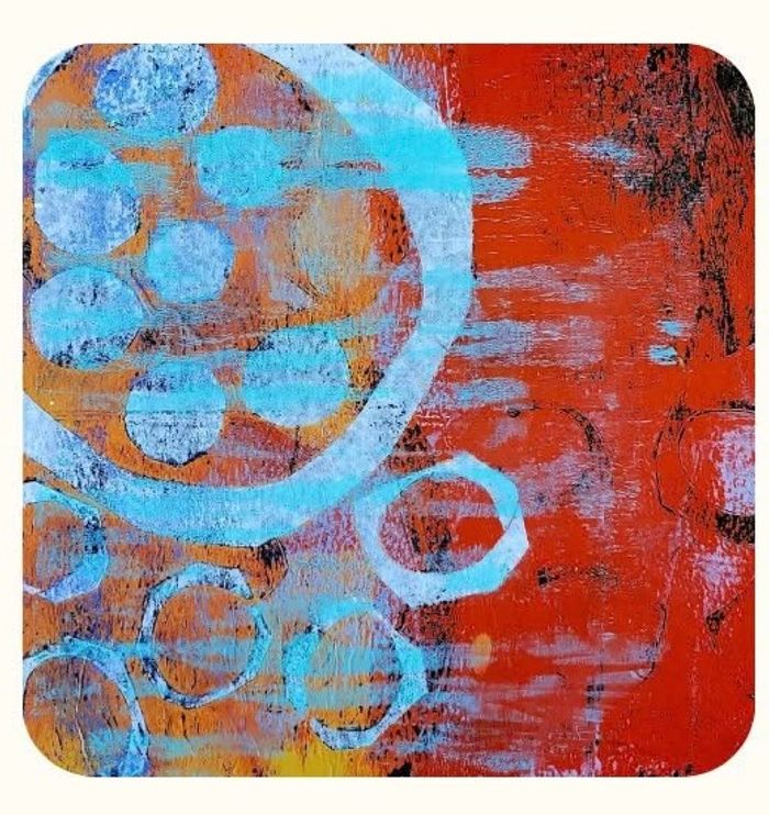Colorful abstract print with red, blue, black and yellow, some circle shapes.