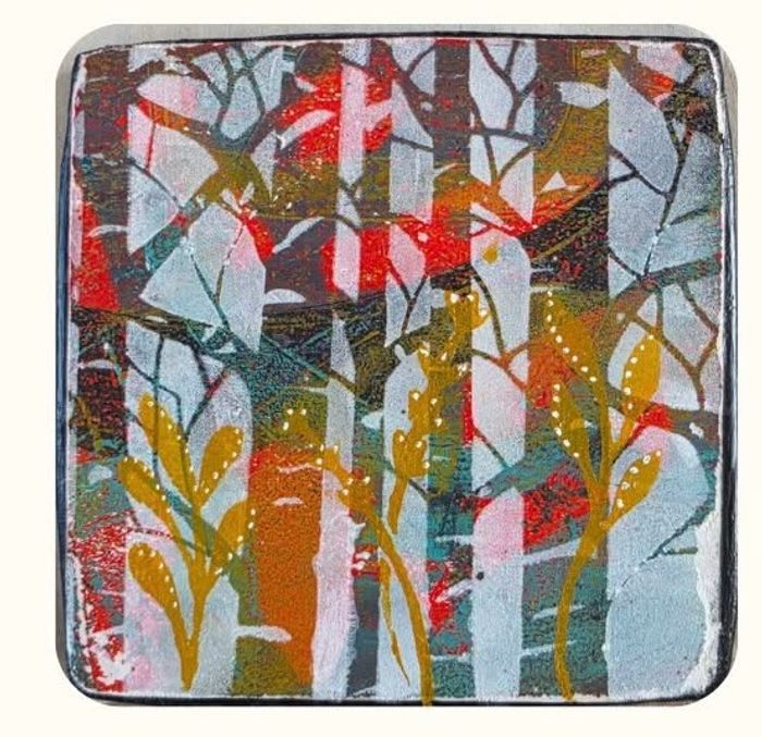 Colorful abstract print with tree silhouette.