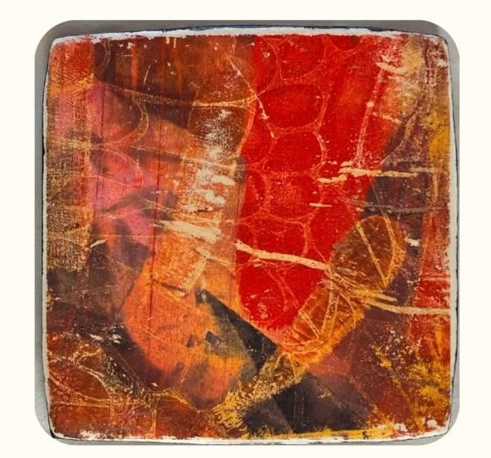 Colorful abstract print with red, black orange and brown.