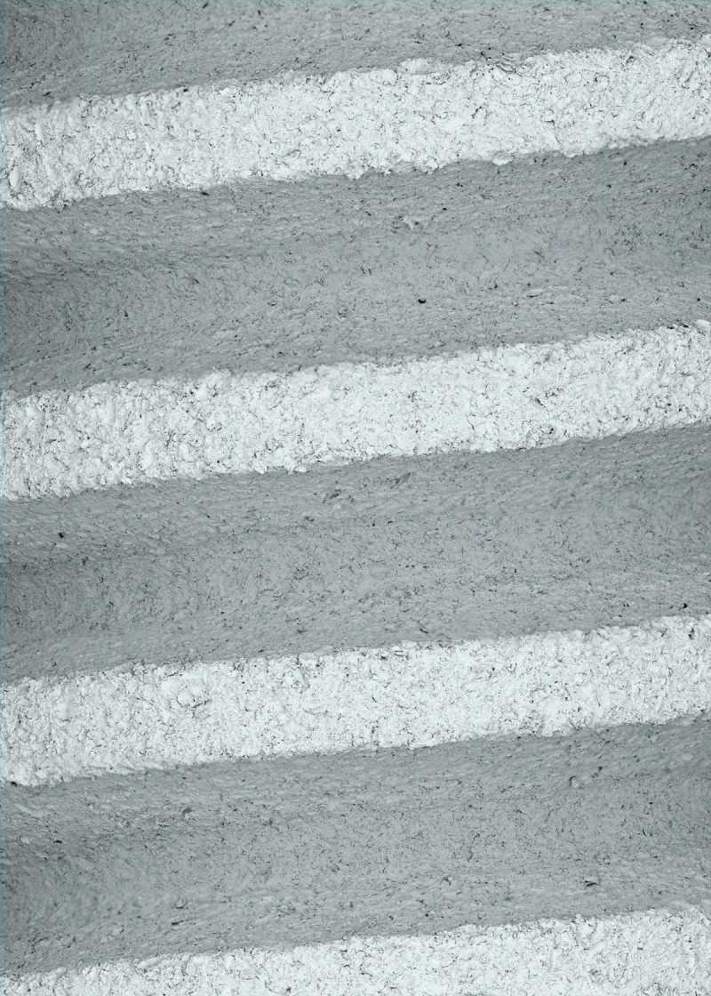 Detail magnification of threaded orthopedic screw showing rough surface texture after post-processing with micro abrasive