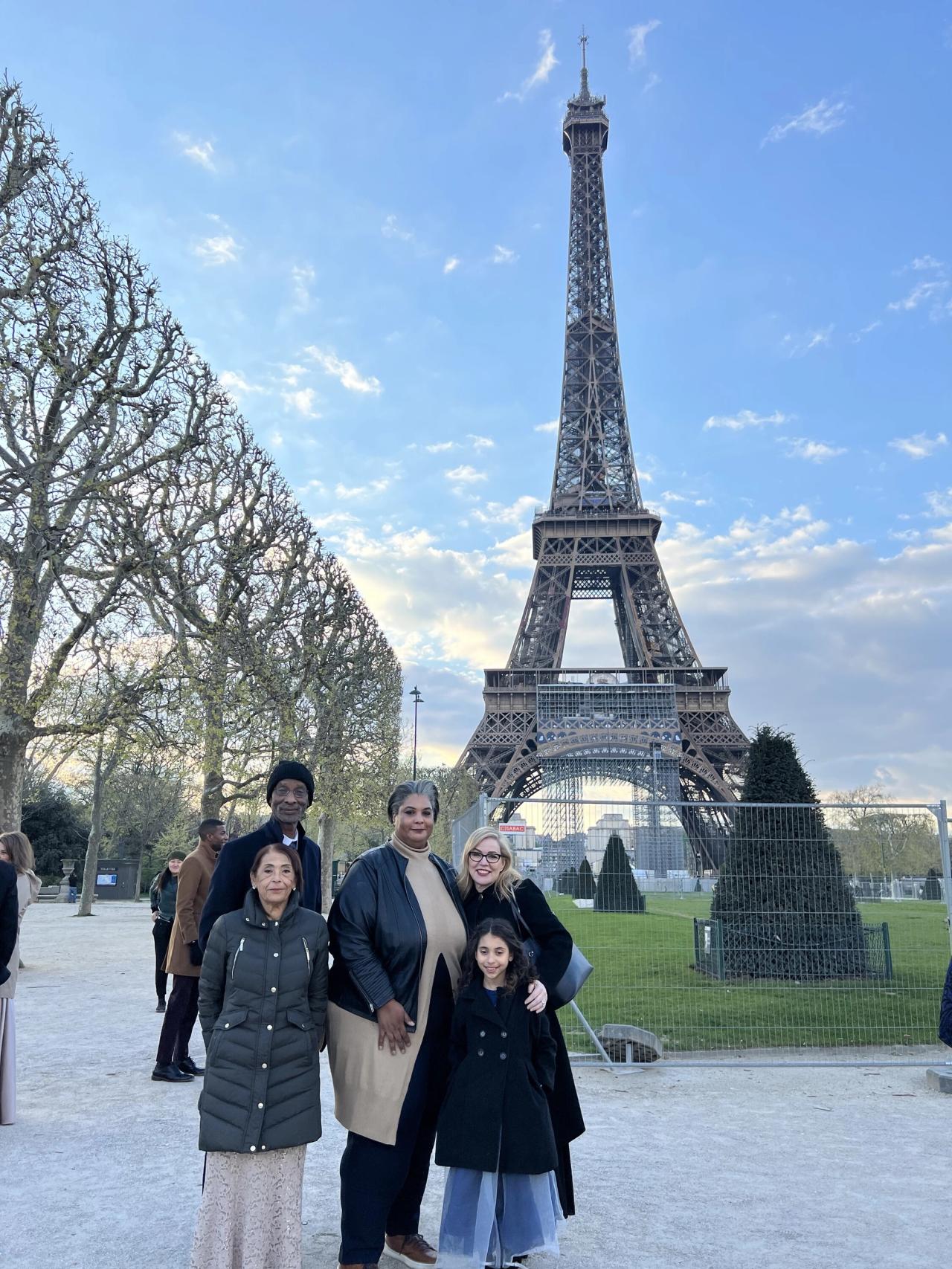 Gay (center) with her wife, Debbie Millman (right) and family members at the Eiffel Tower. (Courtesy Roxane Gay)