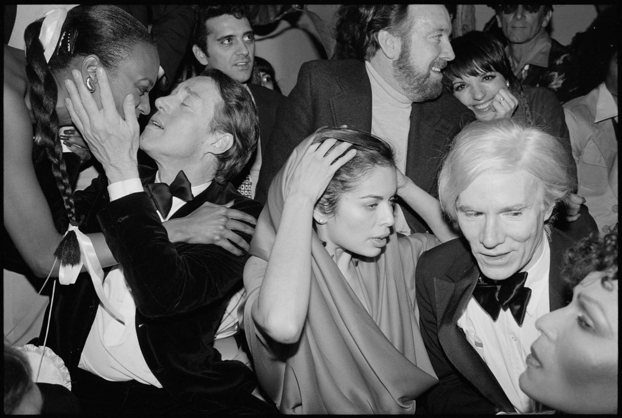 Studio 54 guests including Bianca Jagger (front, center) and Andy Warhol (front, right). (Courtesy Ian Schrager Company)