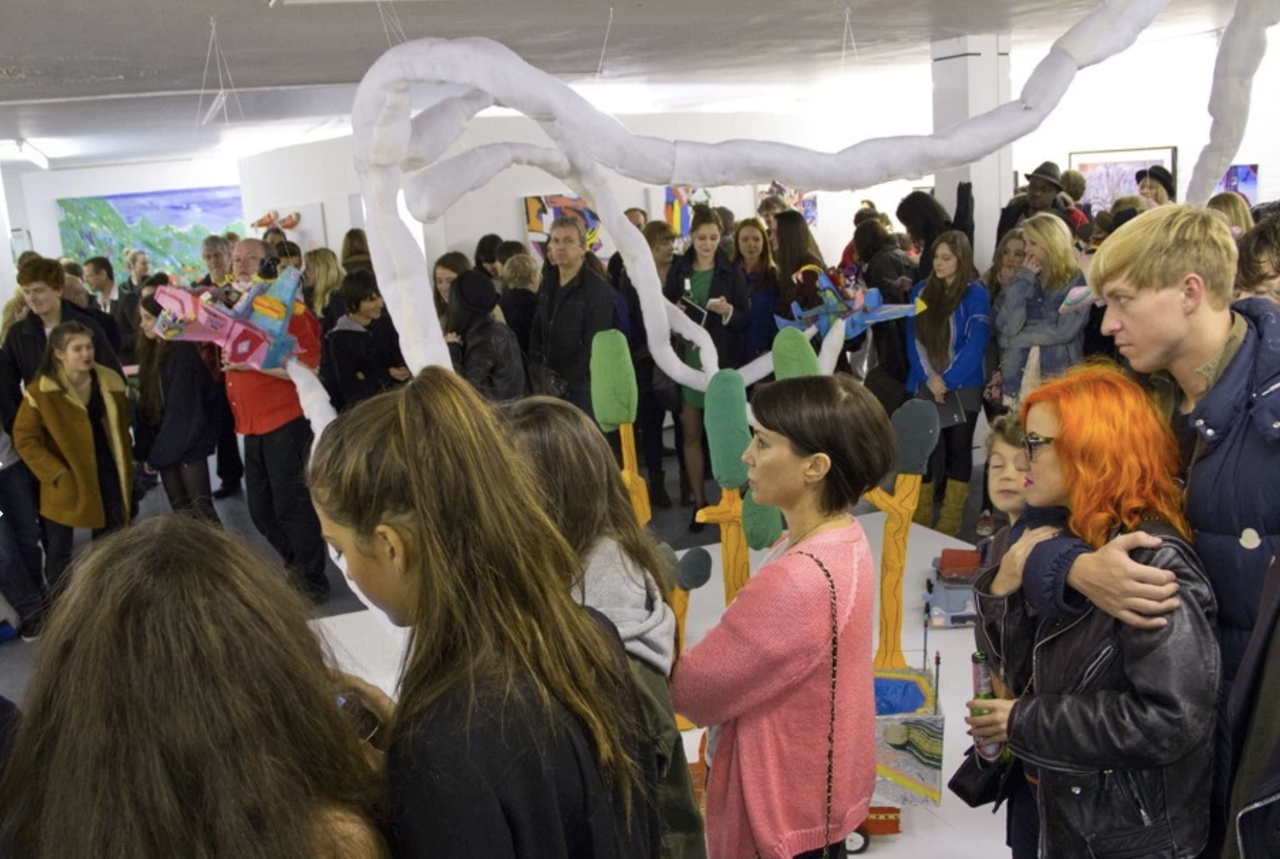 The opening of Schachter’s 2012 exhibition “Friends & Family.” (Courtesy Kenny Schachter)