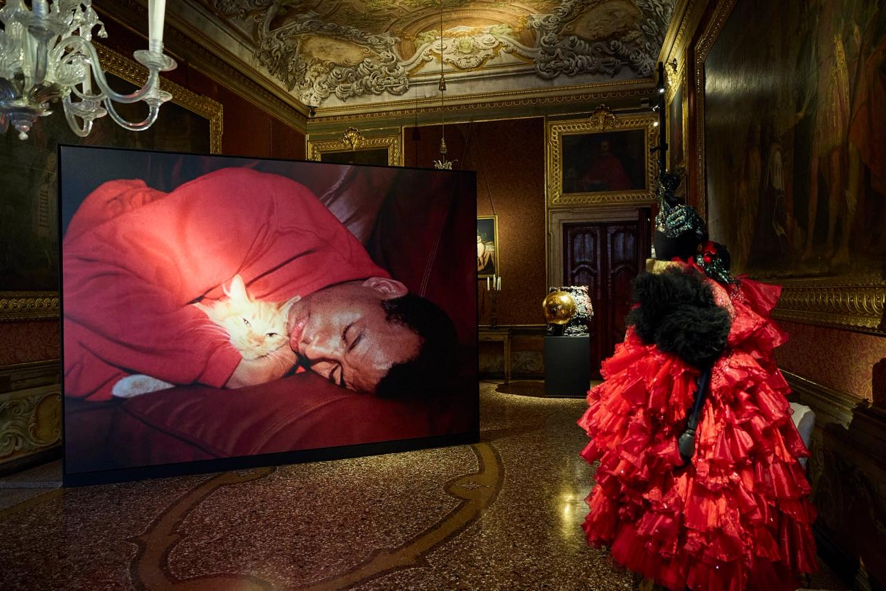 View of Room 2. From left: Steven Shearer’s photograph “Whiskered Sentinel” (2024); Takuro Kuwata’s “Chawan (A25 - 054)” (2025); Comme des Garçons headpiece by artist Julien d’Ys (fall/winter 2018). (Photo: Antonio Campanella for The Slowdown/Copyright Steven Shearer/Courtesy the artist, Galerie Eva Presenhuber, and David Zwirner; Courtesy Pierre Marie Giraud Gallery; Courtesy Comme des Garçons;)