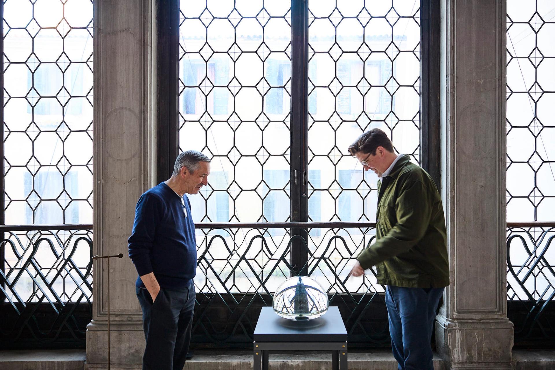 Van Noten, left, and Bailey with “Panorama” (2010), a clear optical glass sculpture by the late Czech artist Václav Cigler. (Photo: Antonio Campanella for The Slowdown/Courtesy Galleria Caterina Tognon, Venezia)