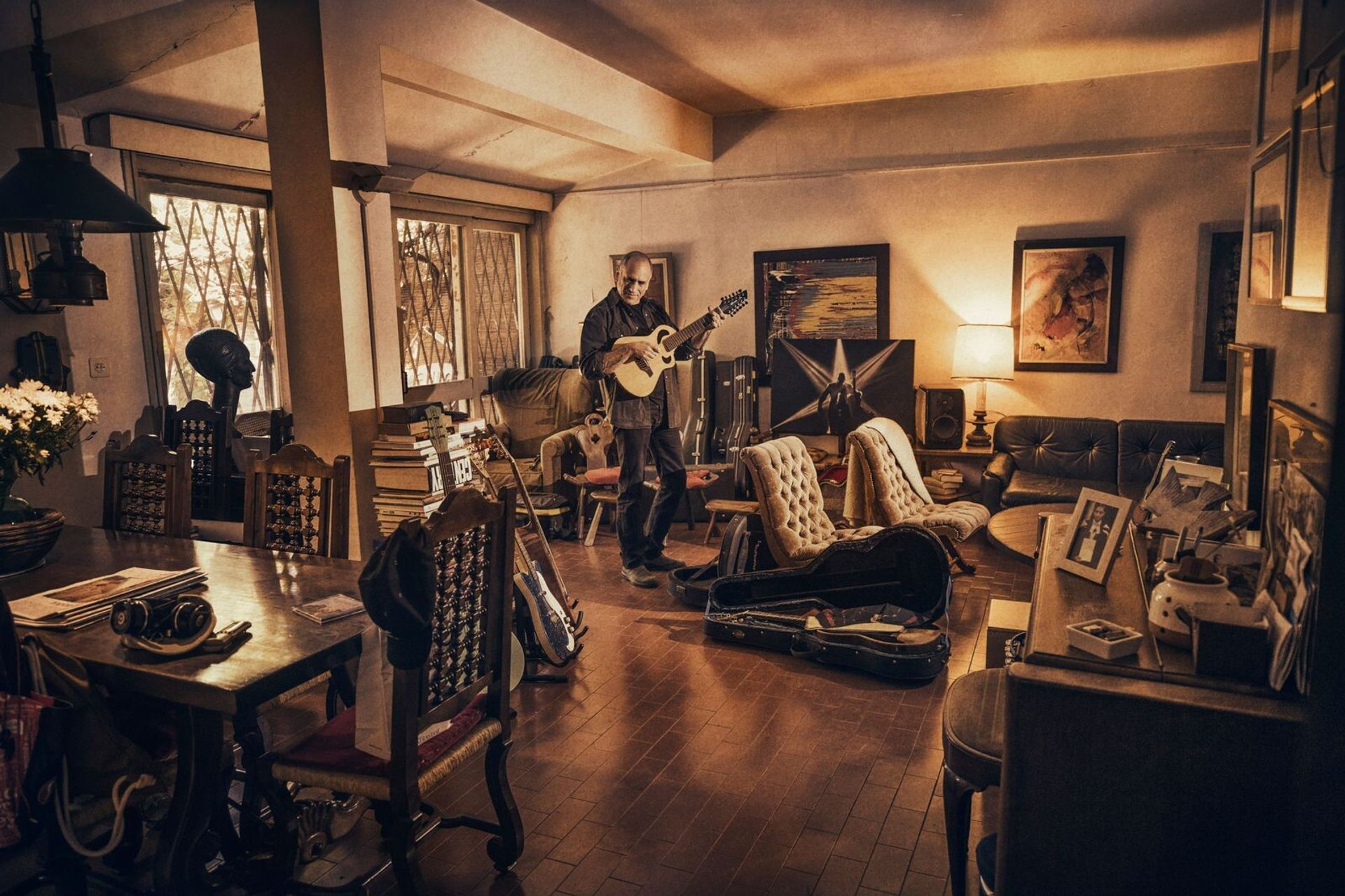 Broza playing the guitar in his childhood home in Tel Aviv. (Photo: Ziv Koren. Courtesy David Broza)