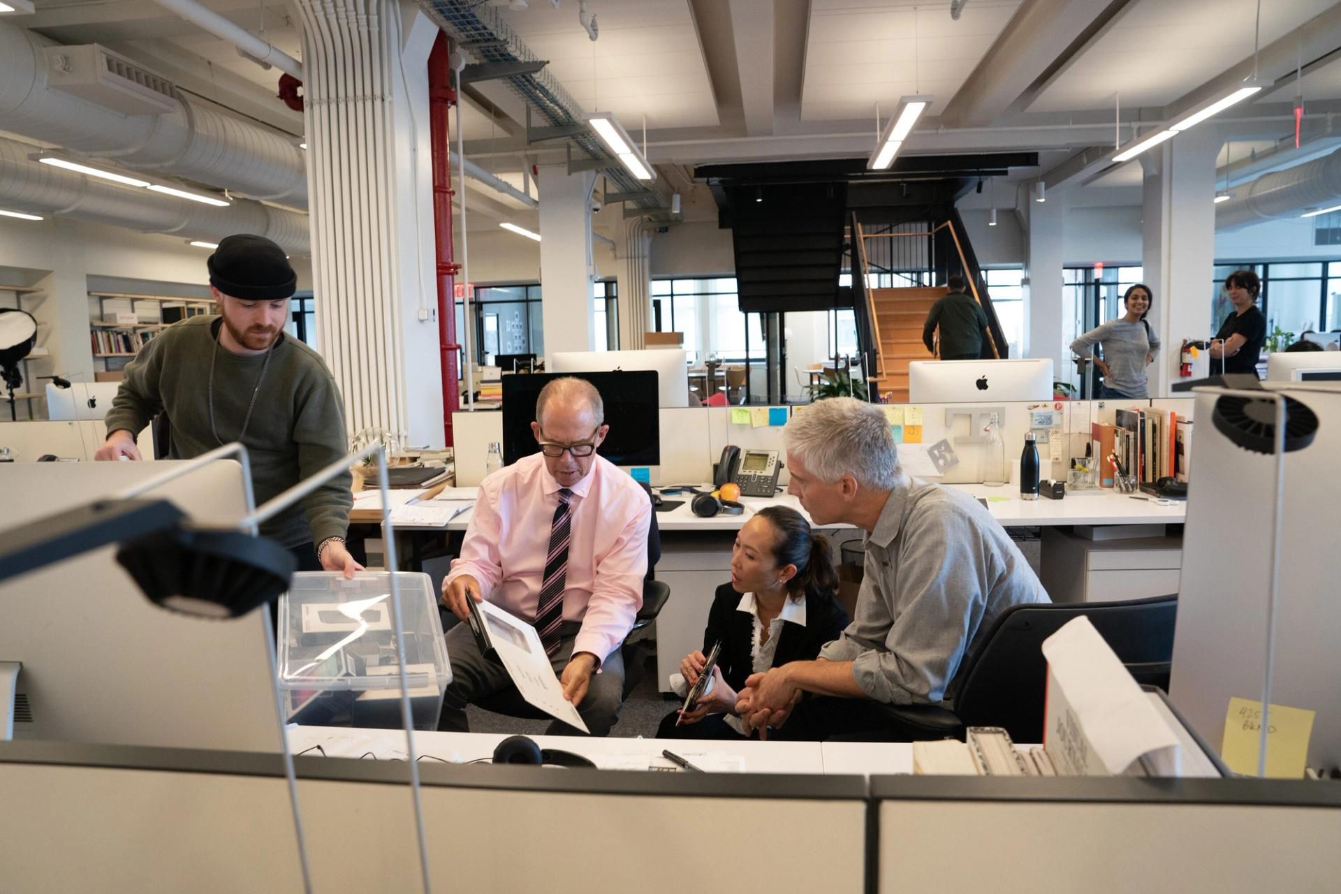 Bierut (center) and some of his colleagues at the Pentagram office. (Courtesy Pentagram)
