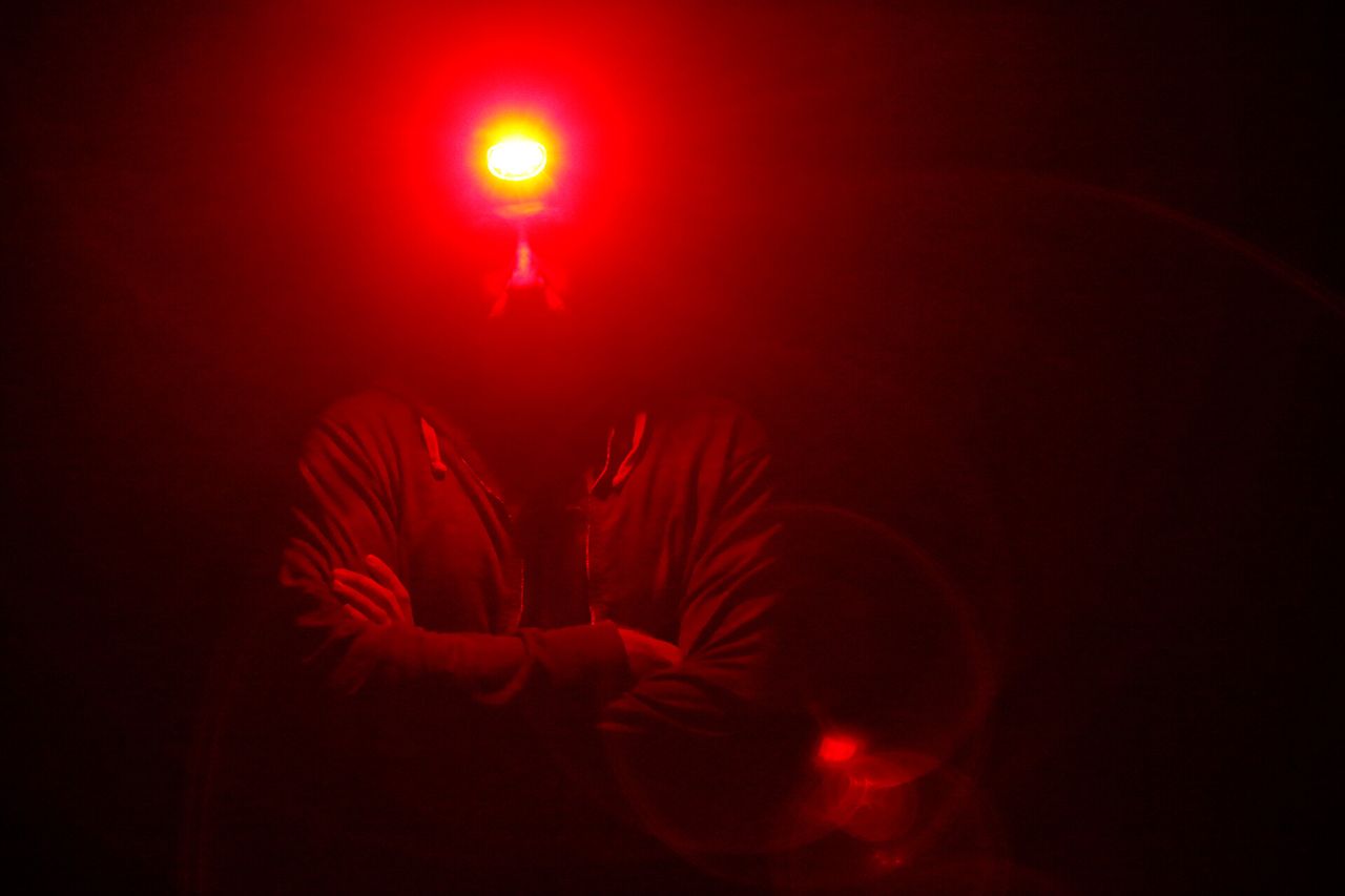 Trevor Paglen with a headlamp on in the dark