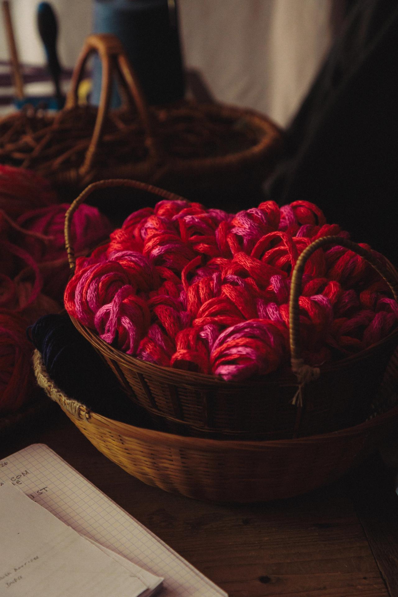 A basket filled with red and pink yarn inside Hicks’s studio in Paris. (Photo: Agathe Karsenti for The Slowdown)
