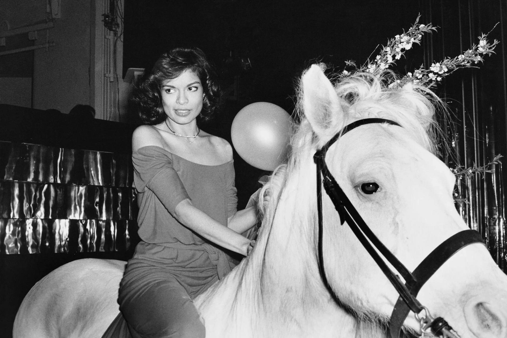 Bianca Jagger riding a white horse at her birthday party at Studio 54 in 1977. (Photo: Rose Hartman)