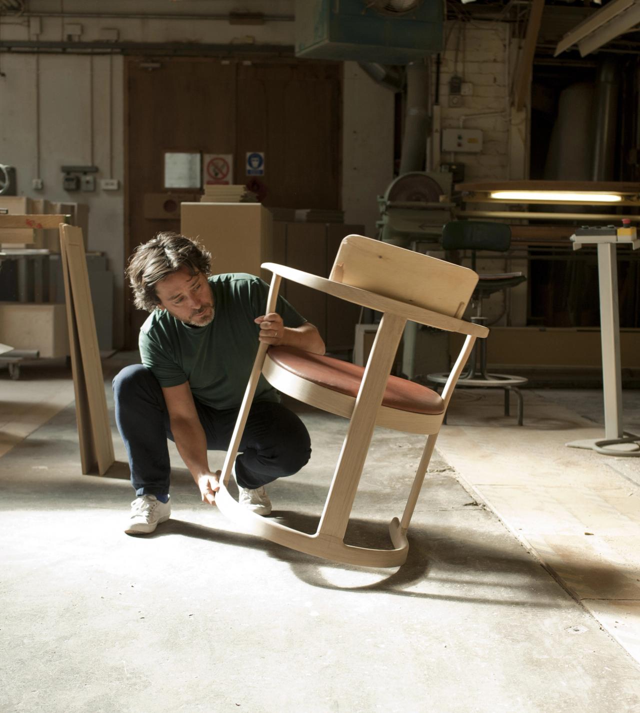 Osgerby with a Bodleian Libraries chair (2014) in the Isokon Plus workshop in London (Courtesy Barber Osgerby Studio)