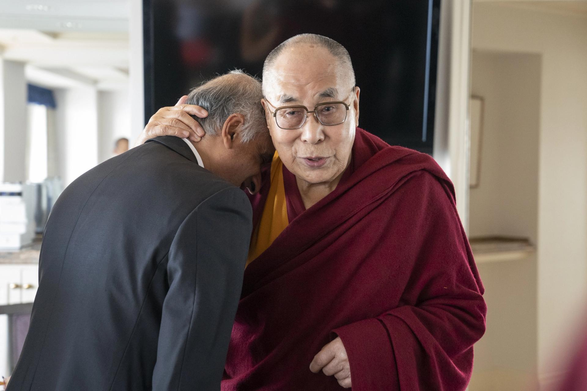 Iyer hugged by His Holiness the Dalai Lama in Japan, November 2018. (Courtesy Pico Iyer/Tenzin Choejor)