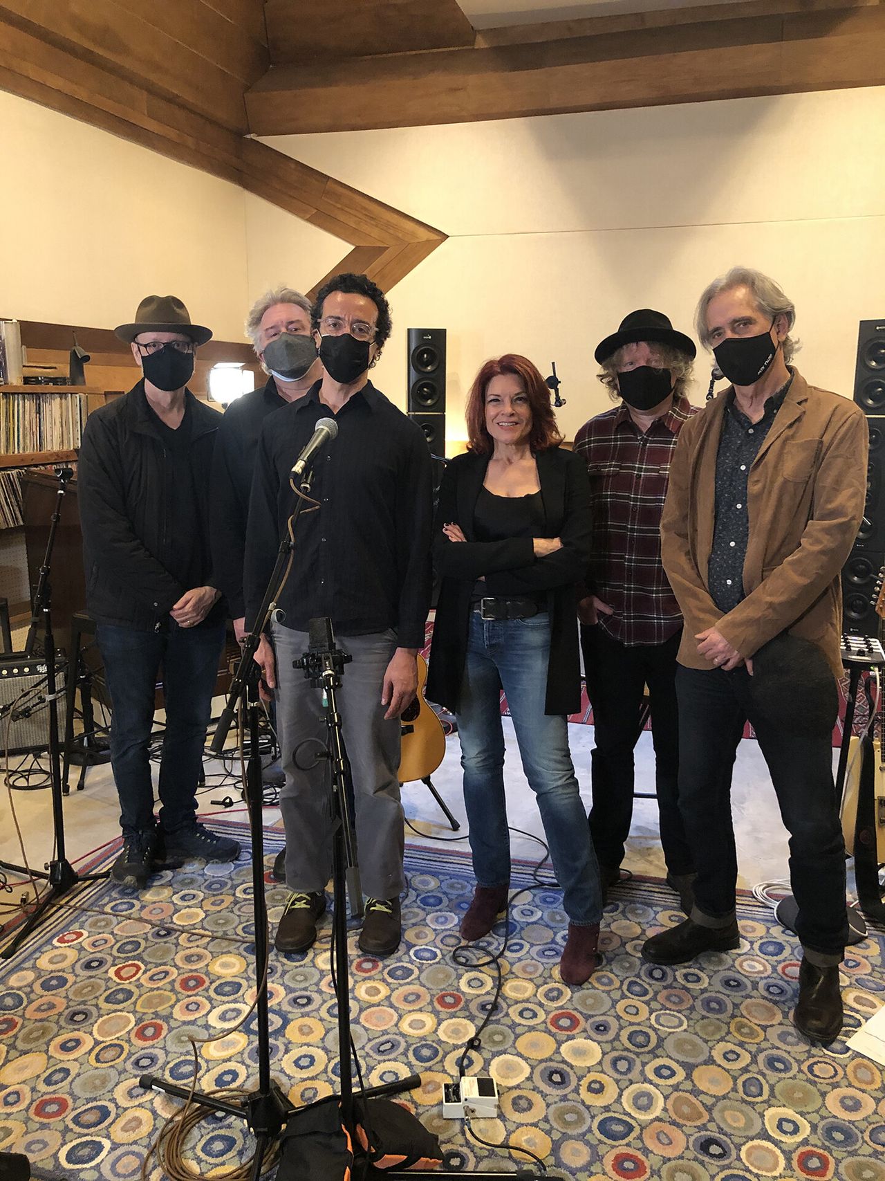 Singer and songwriter Rosanne Cash with her band, all wearing face masks