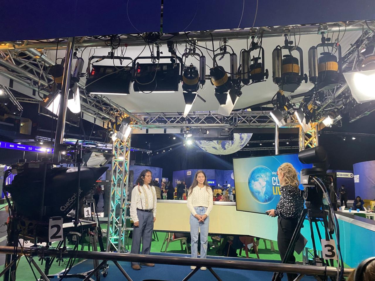 Bastida, right, with her father, Mindahi, filming a segment on Euronews at COP26. (Courtesy Xiye Bastida)