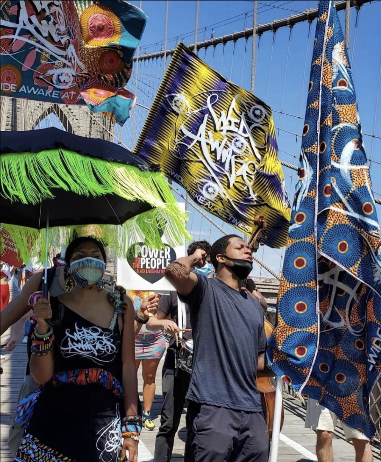 Wide Awakes members walking along the Brooklyn Bridge at a Black Lives Matter Protest in 2020. (Courtesy José Parlá)