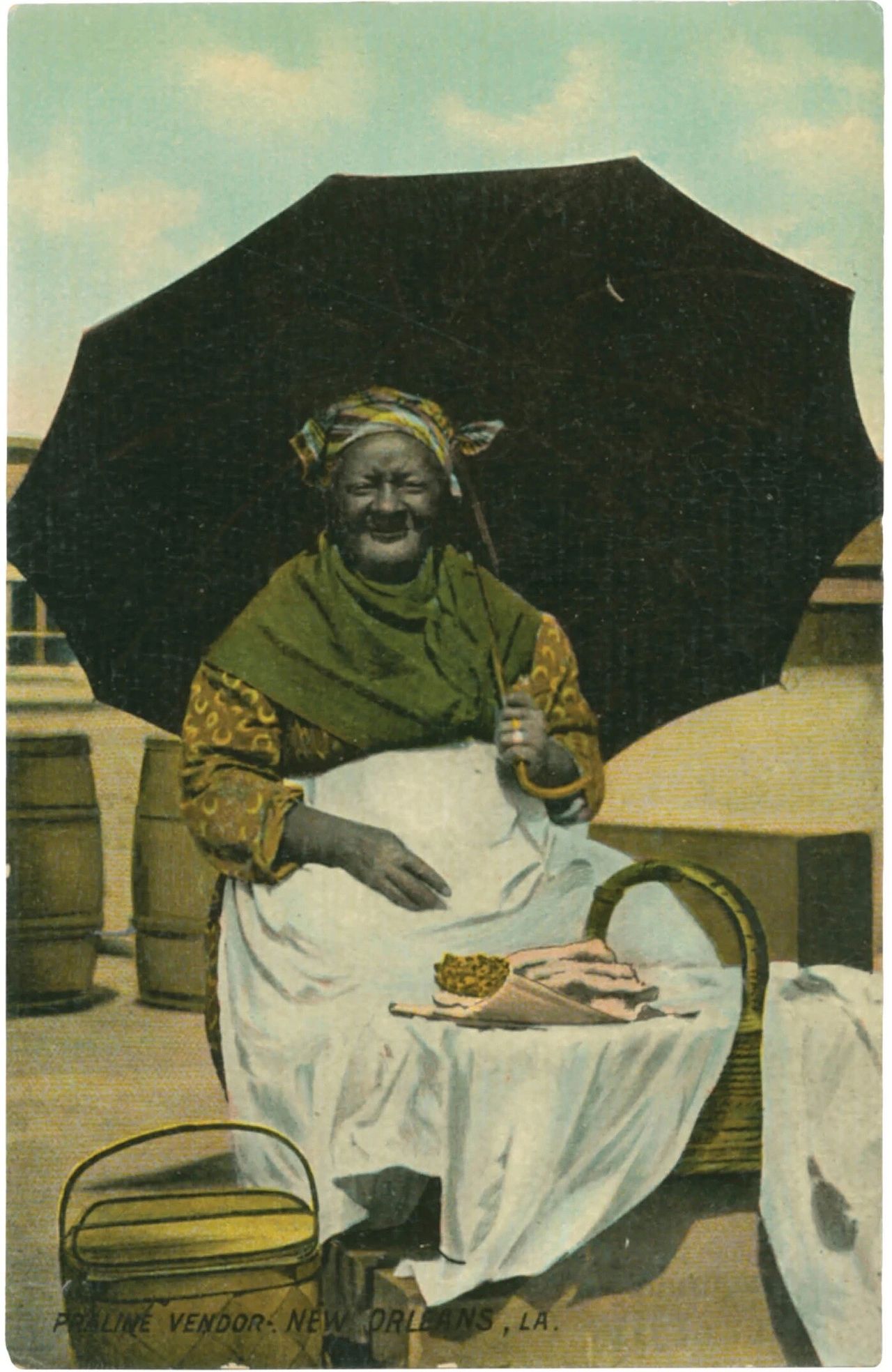 A postcard depicting a praline vendor in New Orleans, as featured in Vintage Postcards from the African World (2020) by Jessica B. Harris. (Courtesy the University Press of Mississippi)