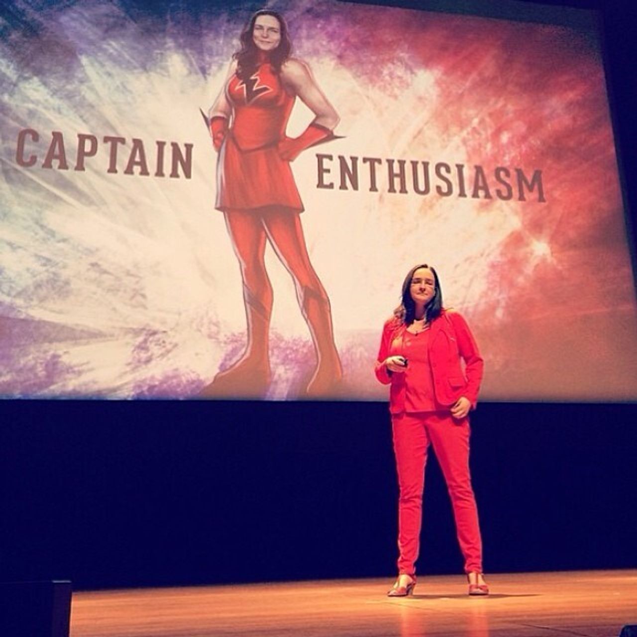 Eisenberg in front of a cartoon drawing of her as “Captain Enthusiasm” at the Adobe 99U Conference in 2018. (Courtesy Tina Roth Eisenberg)