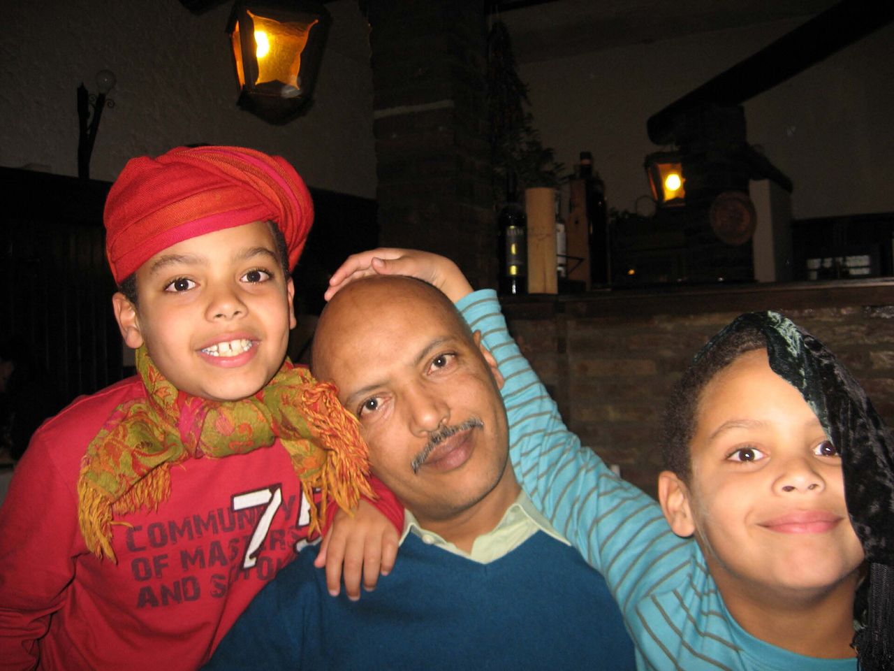 Ficre Ghebreyesus with with sons Solomon Ghebreyesus (left) and Simon Ghebreyesus (right). (Courtesy Elizabeth Alexander)