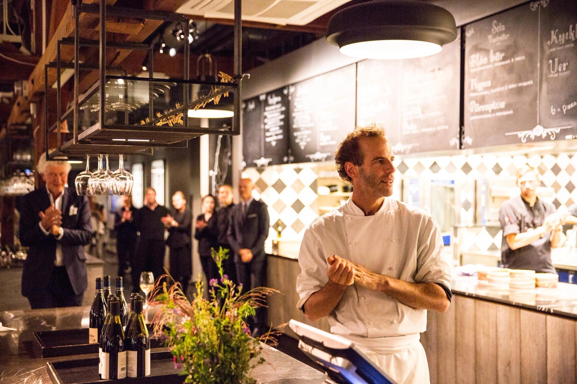 Barber preparing to serve food during his WastED program in Stockholm in 2016. (Photo: David Back. Courtesy Blue Hill)