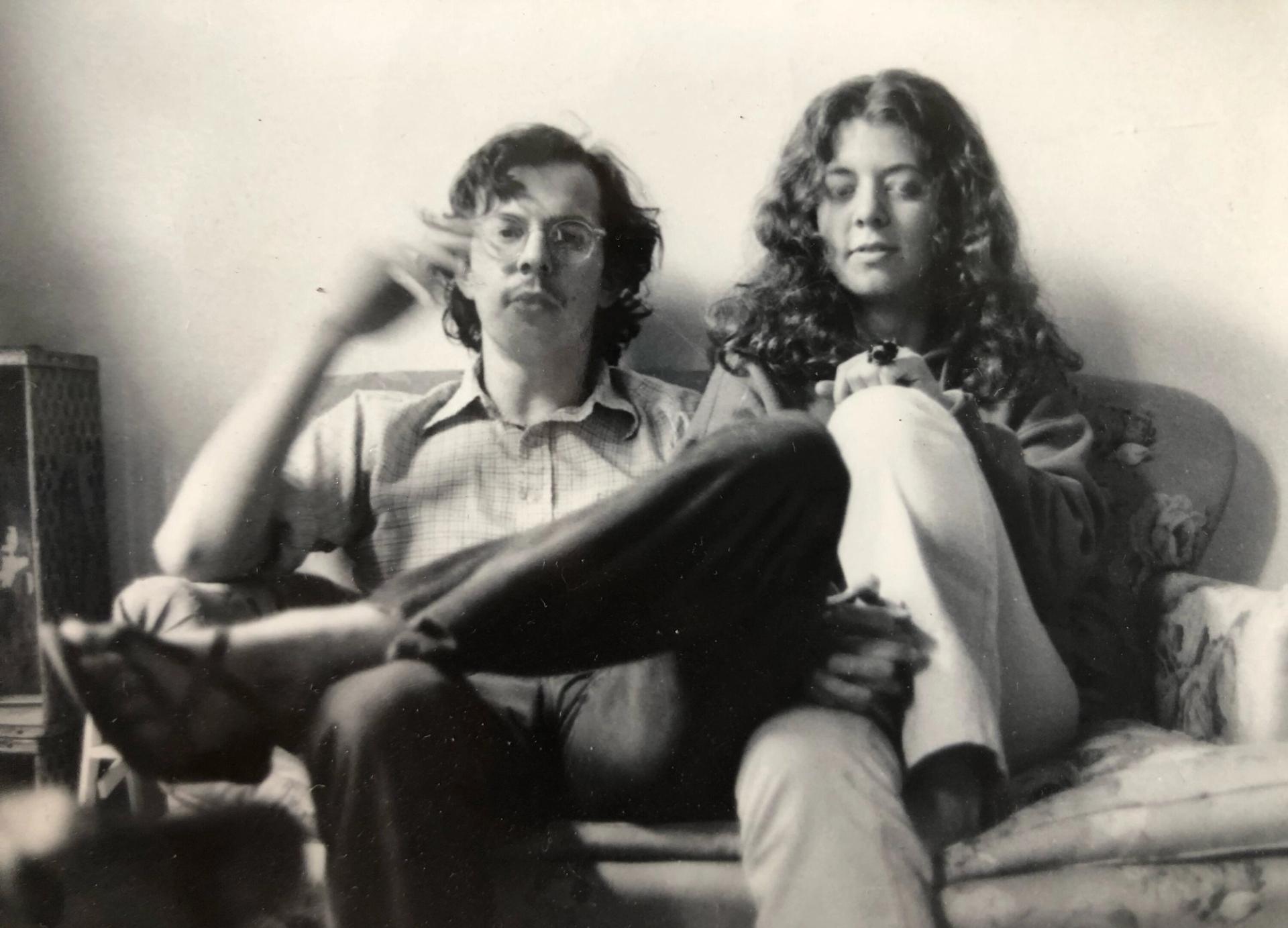 Man and woman sitting on a couch together