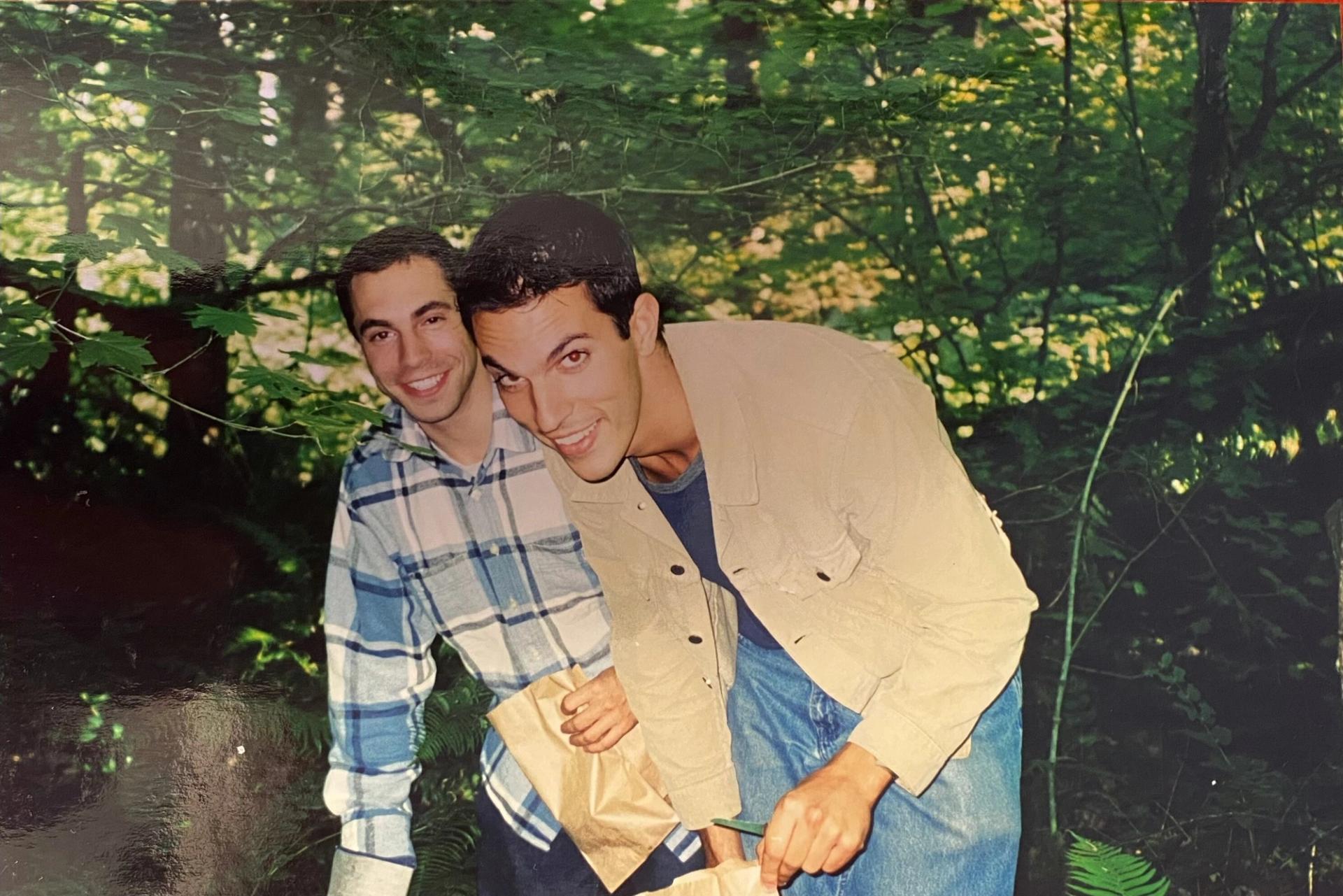 Shapiro (right) hunting for wild mushrooms with his now husband, Michael Gottlieb. (Courtesy Ari Shapiro)