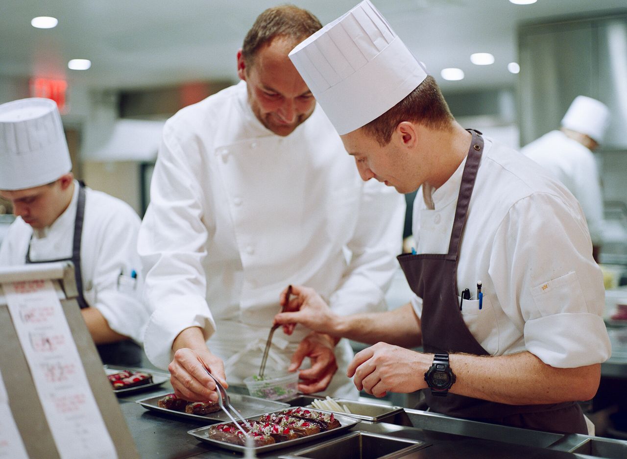 Humm and a team member cooking in the Eleven Madison Park kitchen. (Courtesy Daniel Humm)