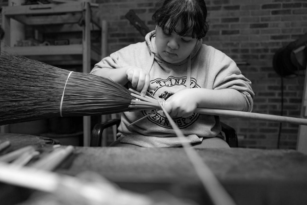 A student in the broom workshop at Berea College. (Photo: Justin Skeens. Courtesy Berea College)