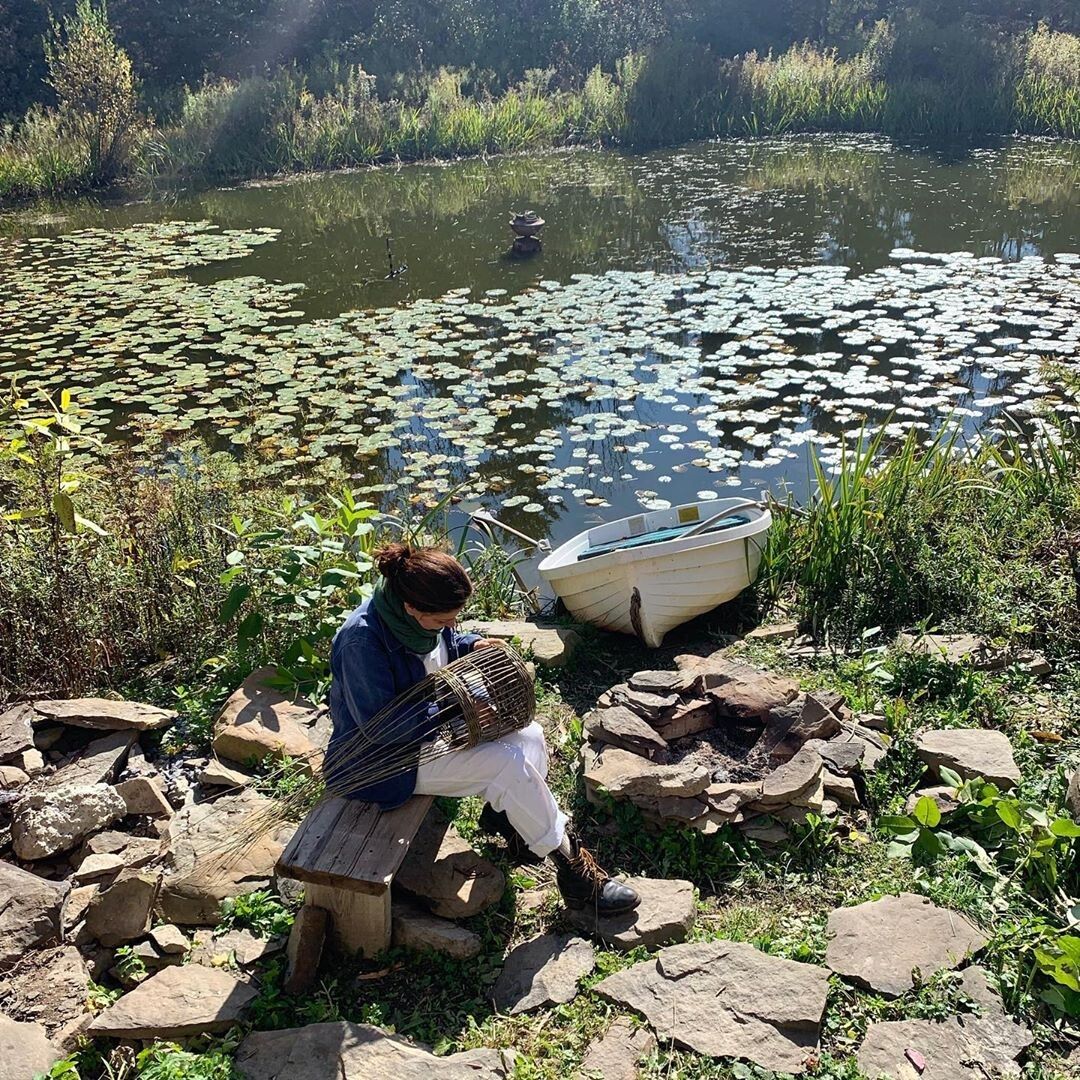 Needleman weaving a basket at her friend Sarah Ryhanen’s farm, World’s End, in Esperance, New York. (Courtesy Deborah Needleman)