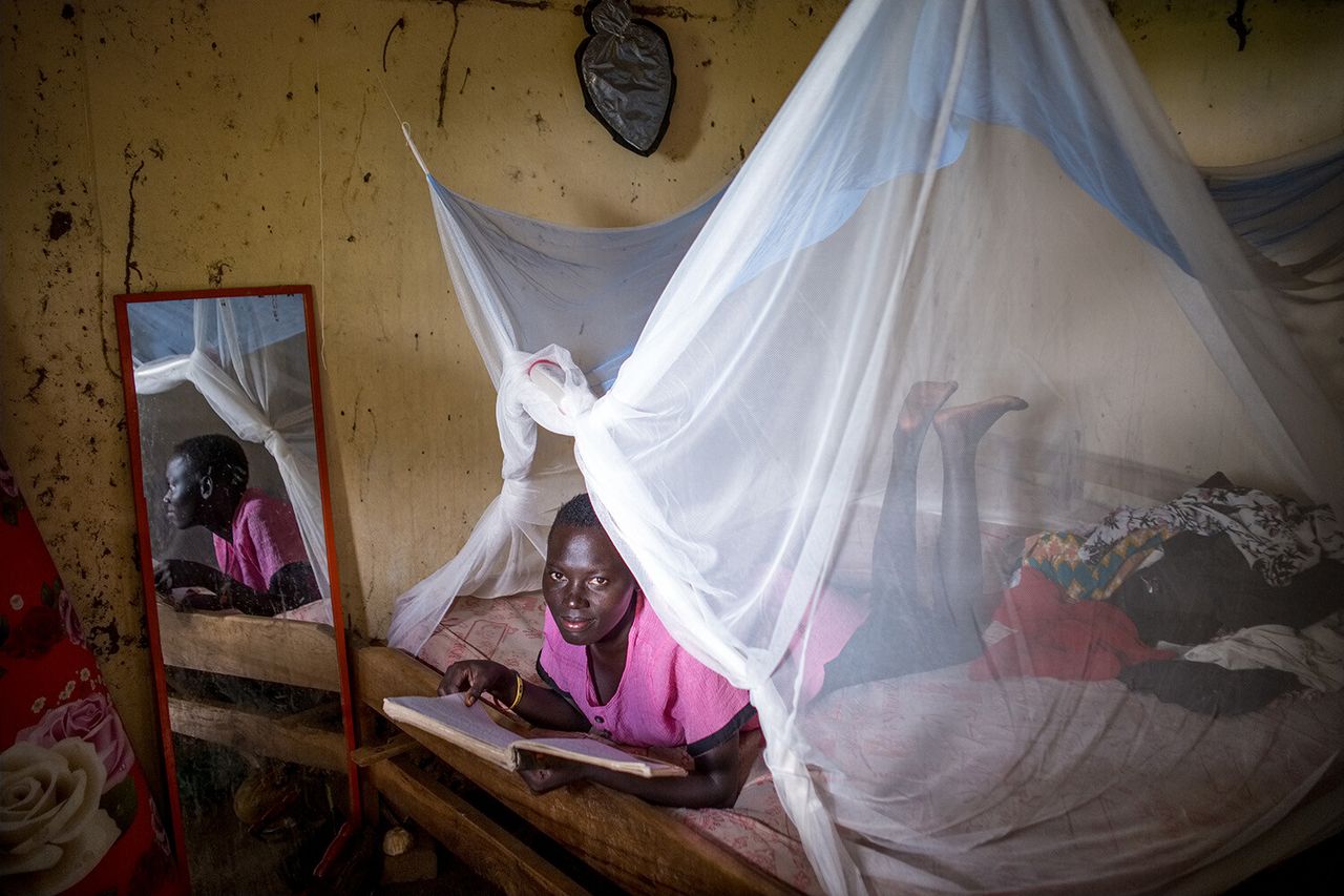 A woman under the PermaNet 3.0 in the Soroti district of Uganda. (Courtesy Vestergaard)