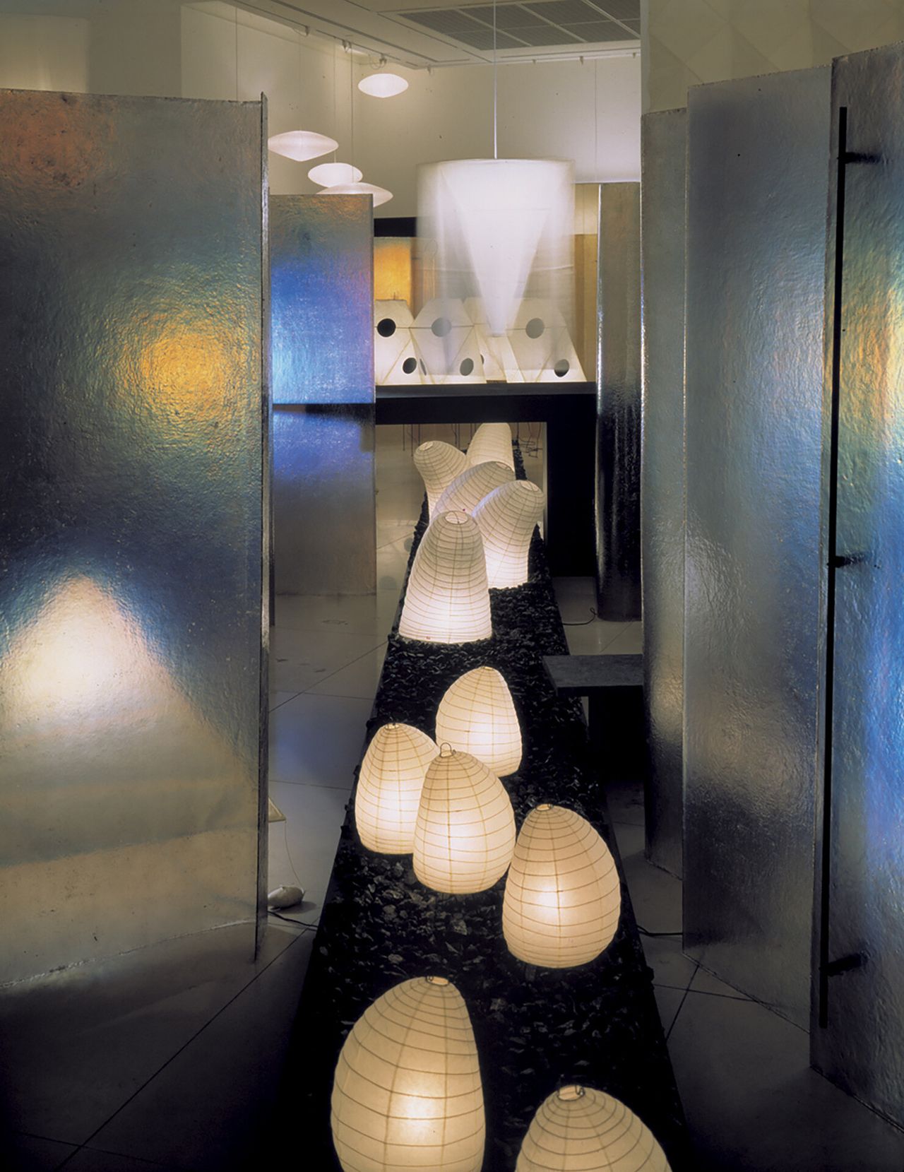Paper lanterns surrounded by glass panels