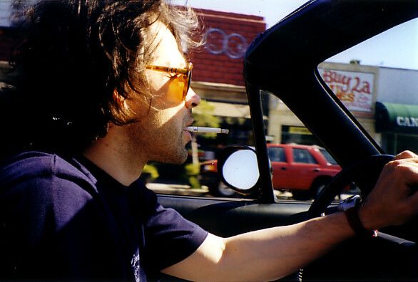 Saville driving in Los Angeles in 1990. (Courtesy Peter Saville)