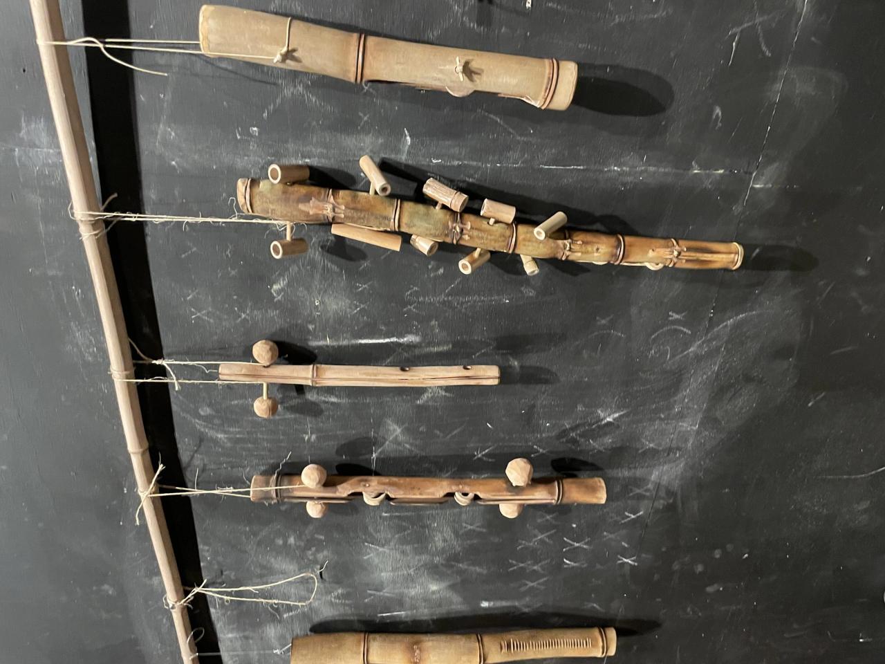 Bamboo instruments crafted by Martin, hanging in his music studio. (Photo: Spencer Bailey)