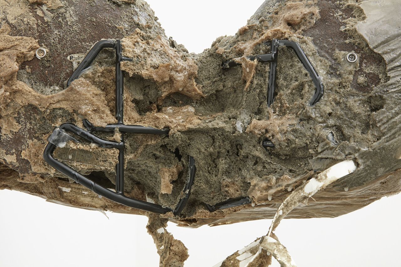 Detail of an artwork made from resin and two N.F.L. helmets