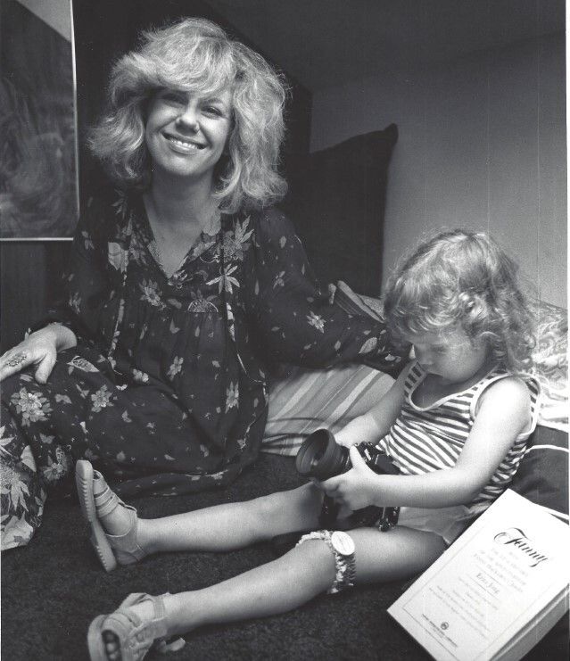 Jong-Fast playing with a camera as a young child, alongside her mother, Erica. (Courtesy Molly Jong-Fast)