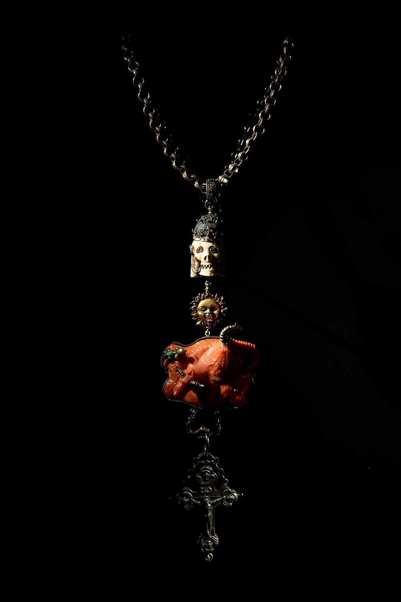 Necklace by A. Codognato with a crowned skull, a sun, a mythological Ophiotaurus, and cross pendant, made with 18-karat yellow gold and silver, mammoth bone, diamonds, sapphires, and antique coral. (Photo: Antonio Campanella for The Slowdown/Courtesy private collection)