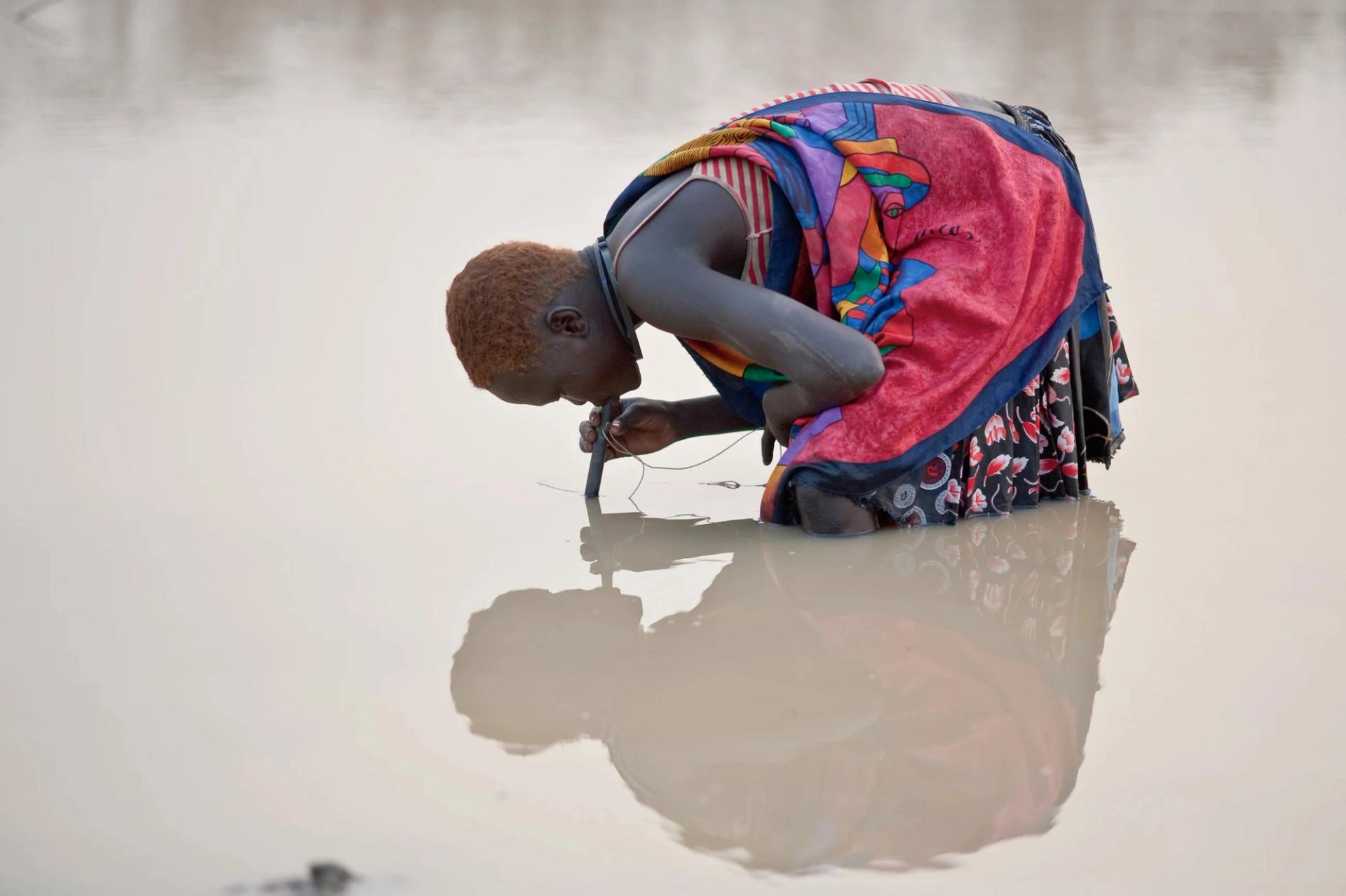A woman using a LifeStraw Guinea worm filter in South Sudan. (Photo: the Carter Center)