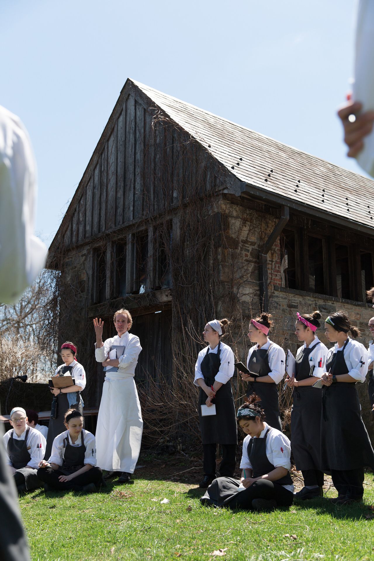 Barber in a meeting with his cooks outside Blue Hill at Stone Barns. (Photo: Jade Nina Sarkhel. Courtesy Blue Hill)