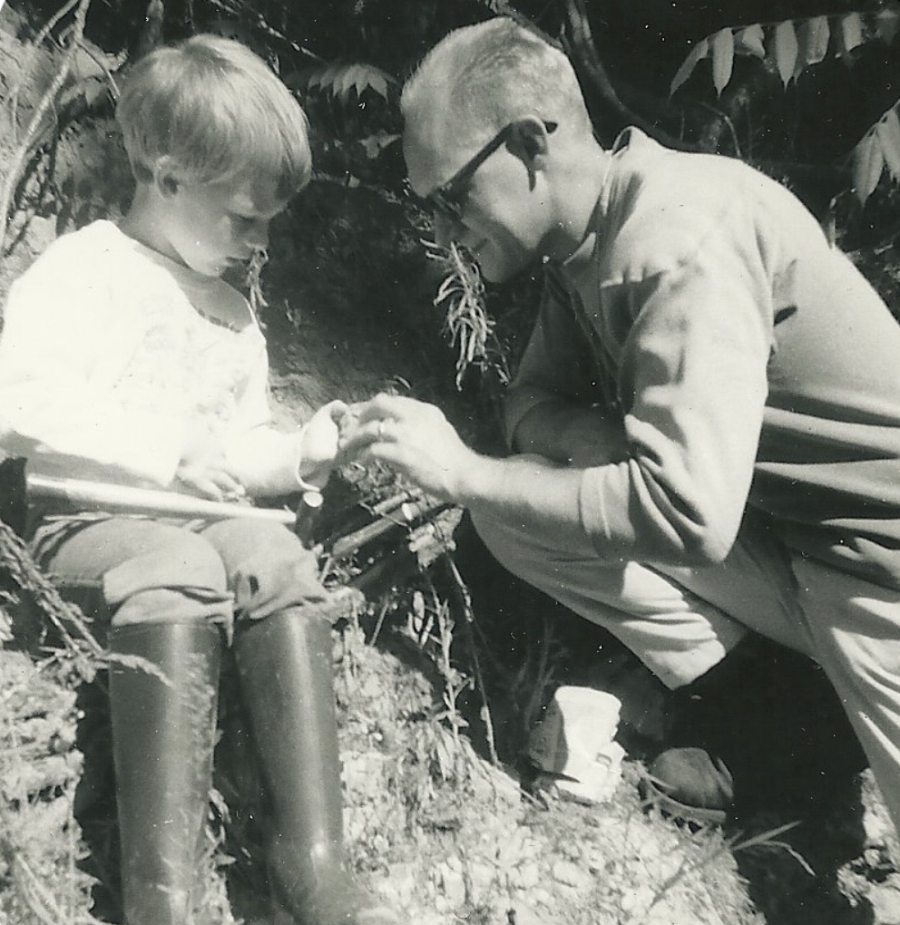 Bjornerud and her father looking for fossils in the sandstone banks of a creek near where she grew up in Wisconsin, around 1966. (Courtesy Marcia Bjornerud)