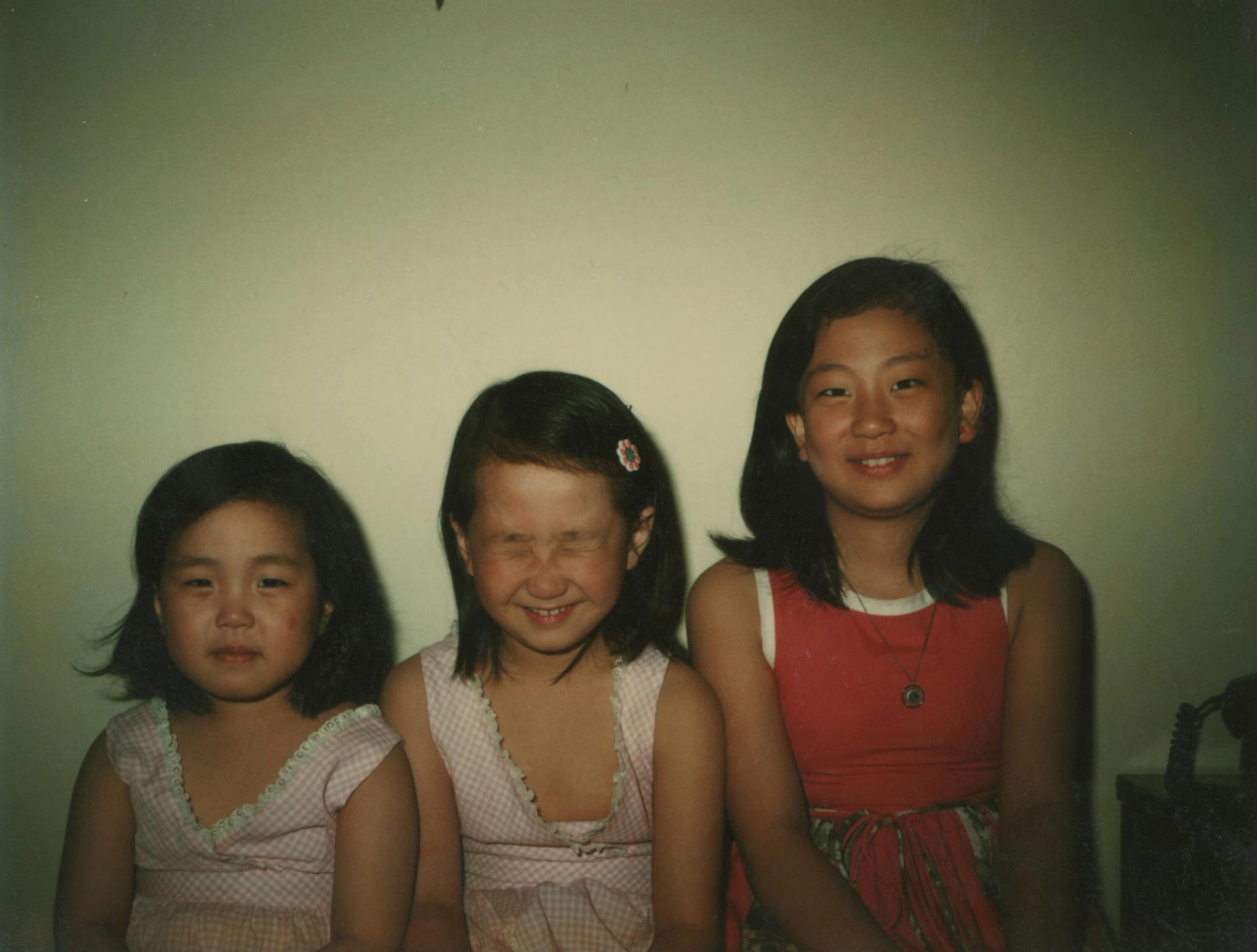 Lee (center) with sisters Sang (left) and Myung (right) circa 1976. (Courtesy Min Jin Lee)