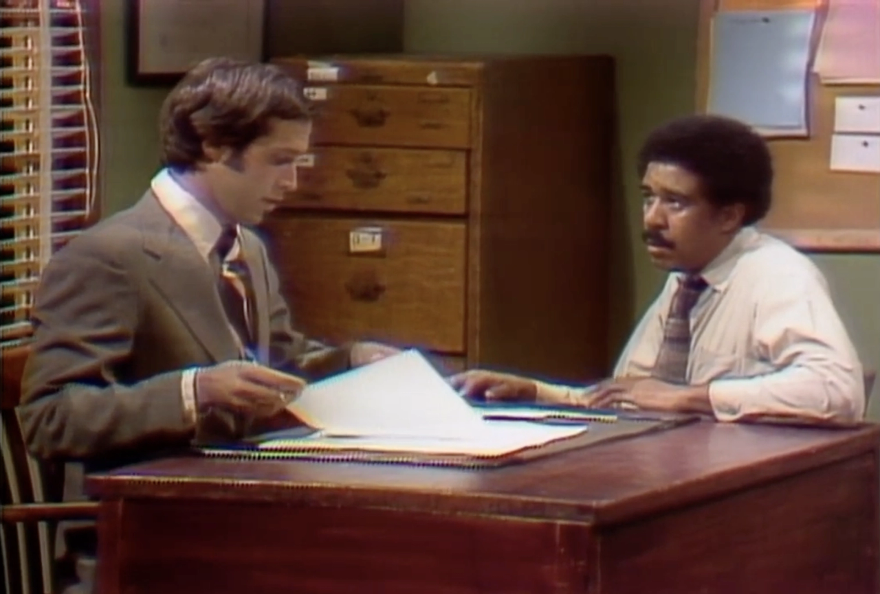 Richard Pryor (right) and Chevy Chase in a 1975 Saturday Night Live skit written by Paul Mooney. (Courtesy NBC)