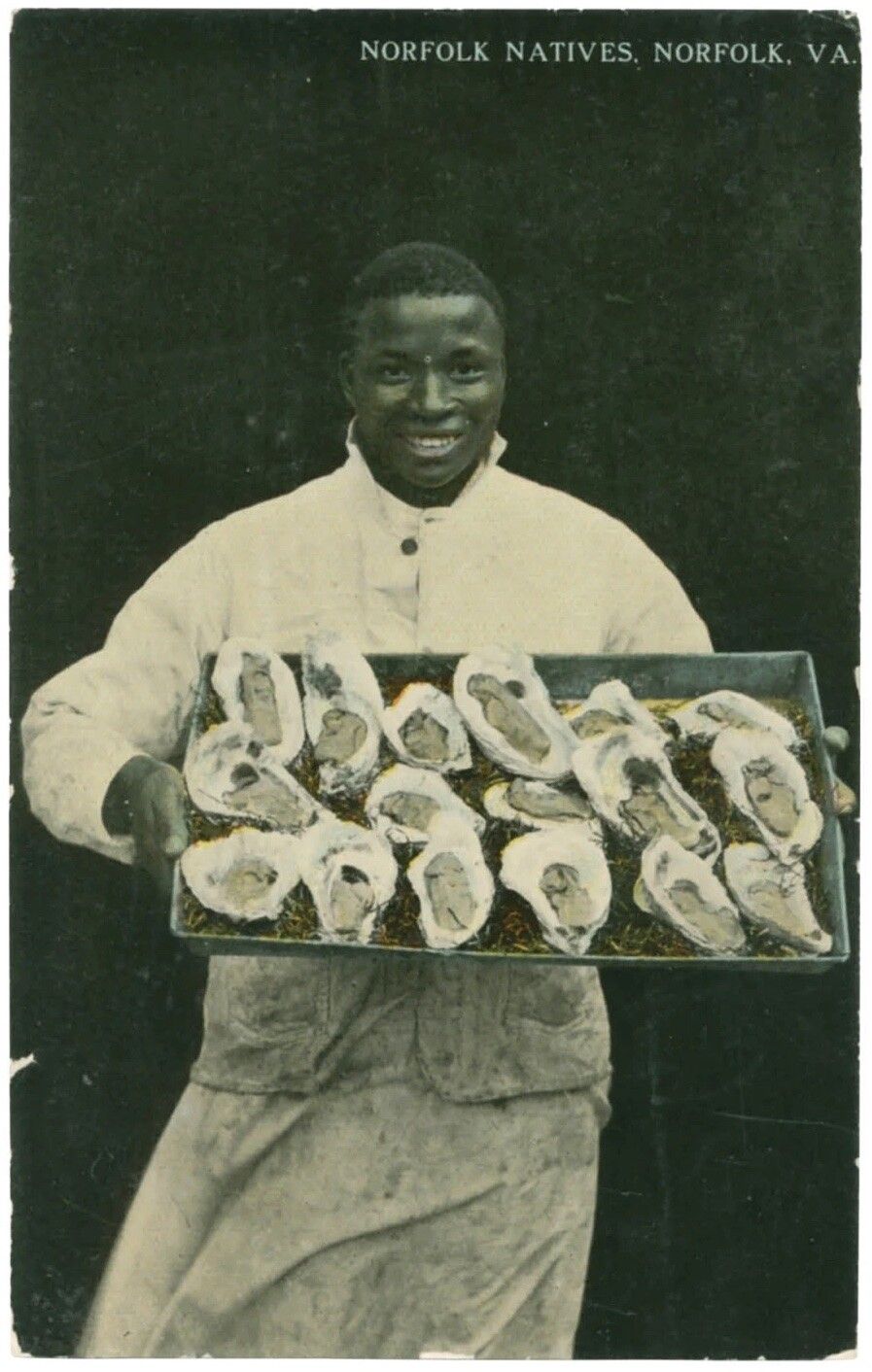 A postcard depicting a native of Norfolk, Virginia, carrying a tray of oysters, as featured in Vintage Postcards from the African World (2020) by Jessica B. Harris. (Courtesy the University Press of Mississippi)