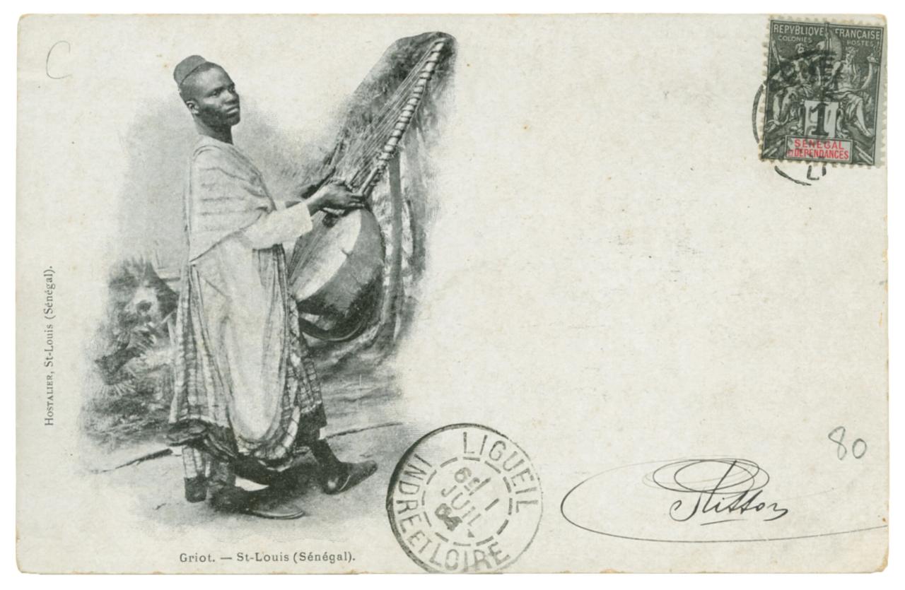 A postcard depicting a griot in Saint Louis, Senegal, as featured in Vintage Postcards from the African World (2020) by Jessica B. Harris. (Courtesy the University Press of Mississippi)