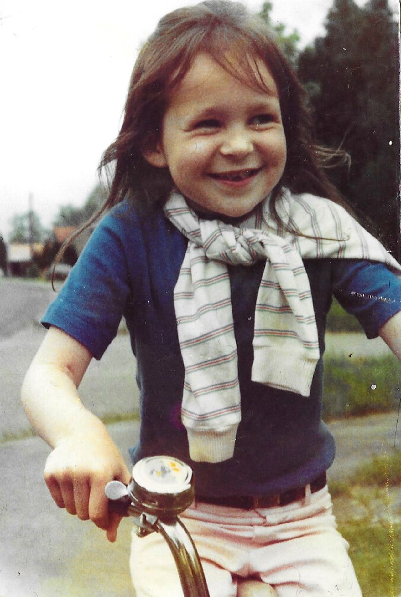 Laing riding a bicycle as a child. (Courtesy Olivia Laing)