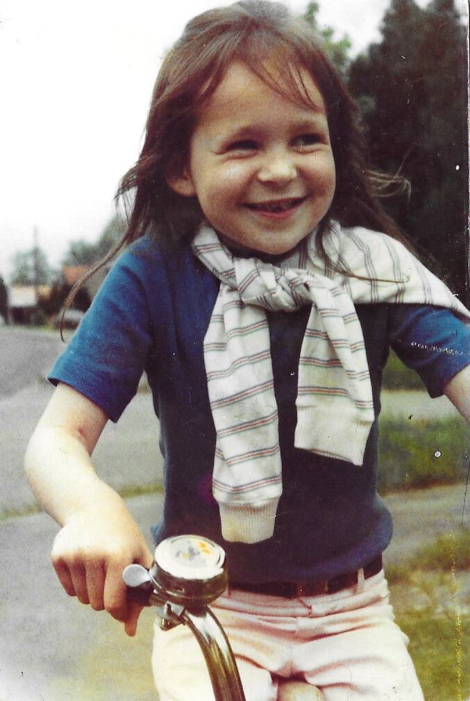 Laing riding a bicycle as a child. (Courtesy Olivia Laing)