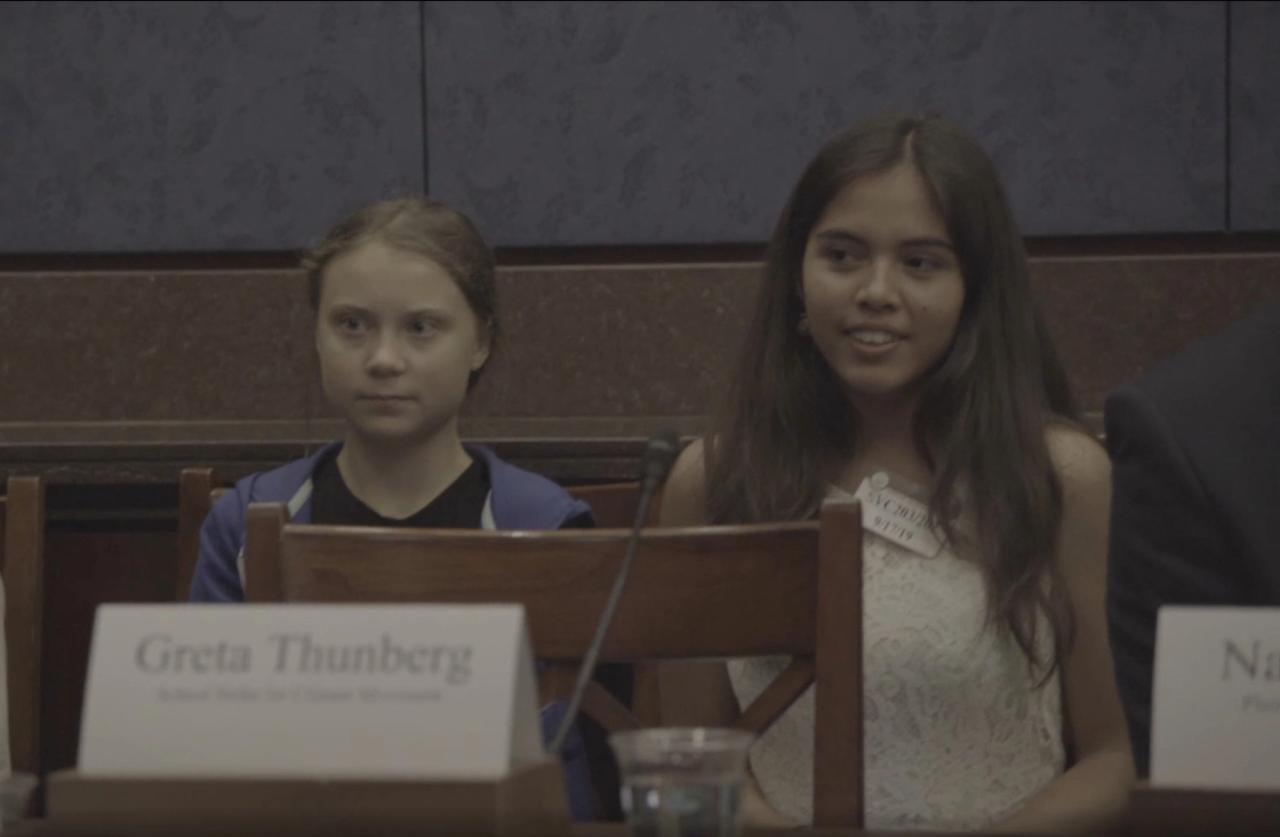 Bastida, right, with Greta Thunberg in 2019, in front of U.S. Congress, with the Senate Climate Change Task Force as supporters of the 21 plaintiffs in the Juliana v. United States case. (Courtesy Xiye Bastida)