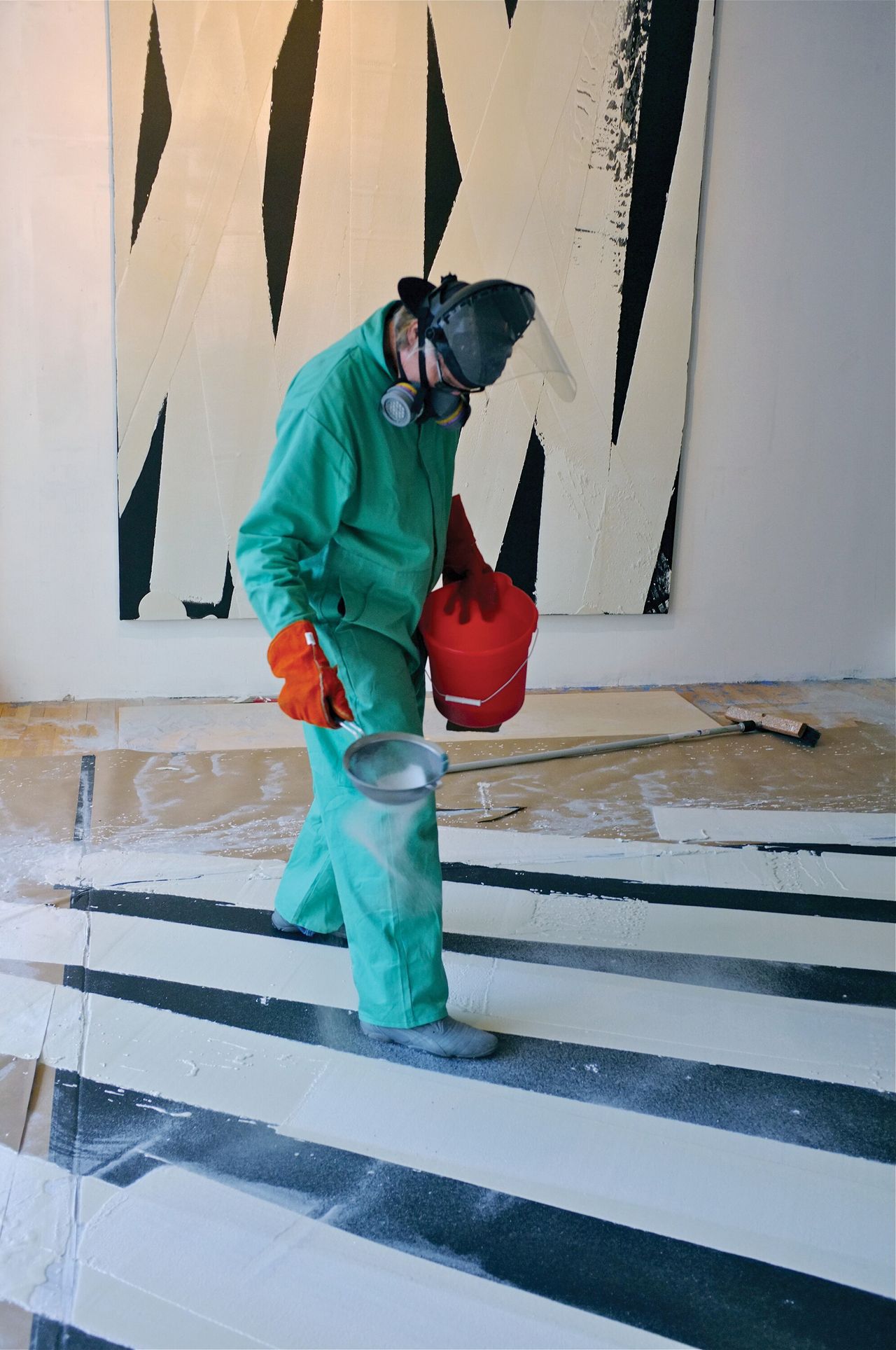 Nares coating lines with glass microspheres for her series Road Paint. (Photo: Elizabeth Blake. Courtesy Rizzoli and Kasmin Gallery)