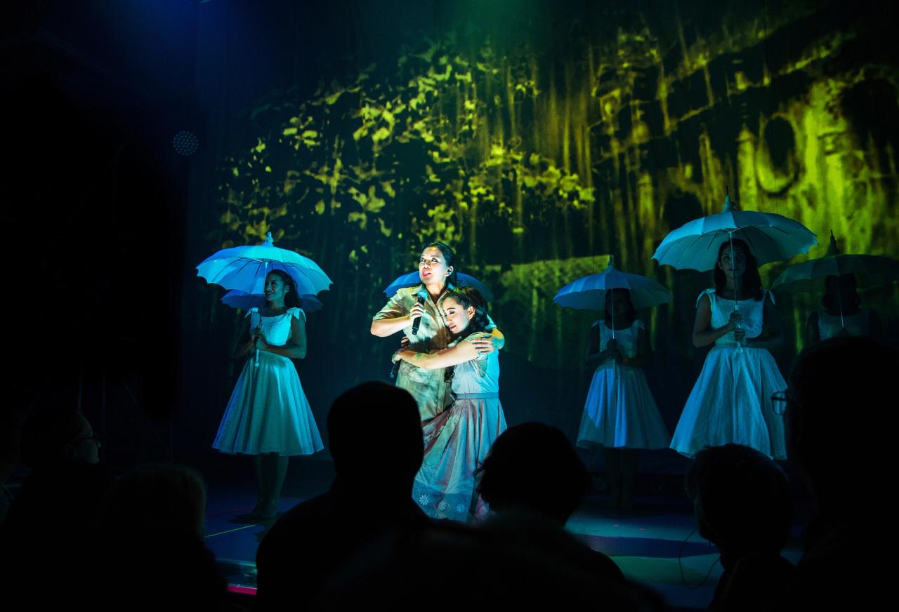 Melody Butiu (Estrella), Jaygee Macapugay (Imelda Marcos), and members of the cast in Seattle Rep’s production of Here Lies Love (2017). (Photo: Navid Baraty)