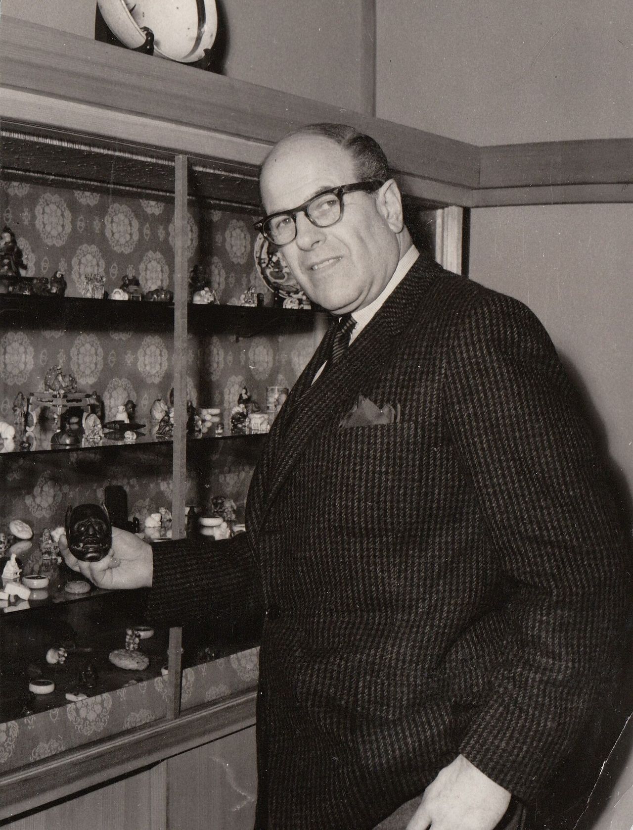 Iggie von Ephrussi, de Waal’s great uncle, pictured with part of the family’s netsuke collection. (Courtesy Edmund de Waal)