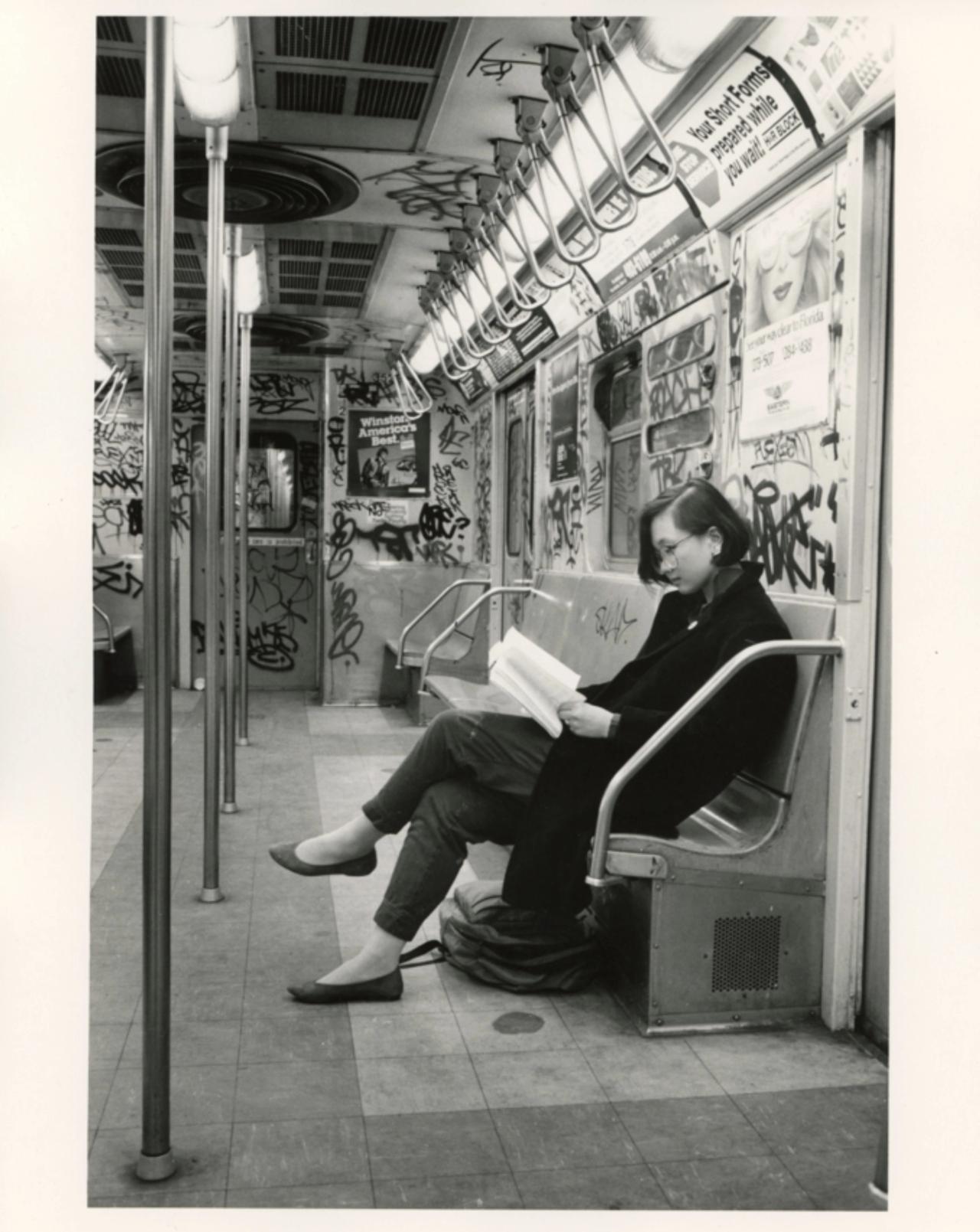 Lee reading a book on the train on her way to Bronx Science. (Courtesy Min Jin Lee)