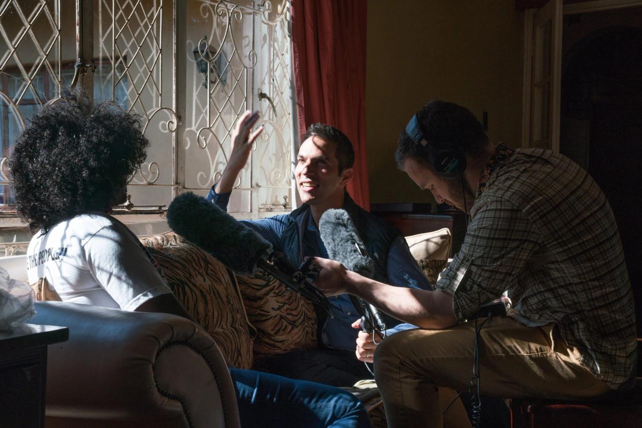 Shapiro (center) interviewing activist Savanna Madamombe (left) in Zimbabwe in 2018. (Courtesy Ari Shapiro)